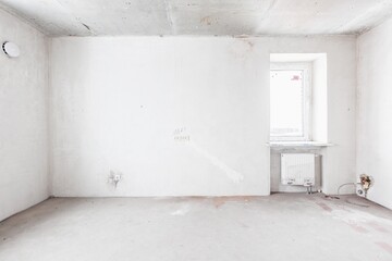 interior of the apartment without decoration in gray colors. rough finish