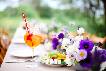 Orange cocktail on table during party