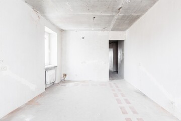 interior of the apartment without decoration in gray colors. rough finish