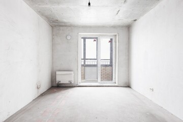 interior of the apartment without decoration in gray colors. rough finish