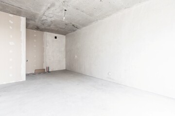 interior of the apartment without decoration in gray colors. rough finish