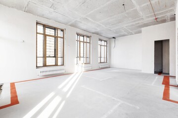 interior of the apartment without decoration in gray colors. rough finish
