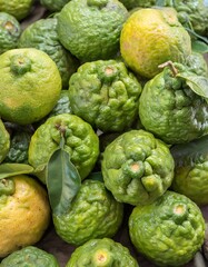 Fototapeta premium Whole and cut ripe bergamot fruits as background, top view