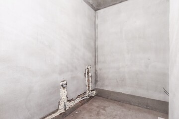 interior of the apartment without decoration in gray colors. rough finish