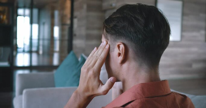 Man experiencing headache, common health concern. discomfort headache, emphasizing impact well-being. importance health commonality ailments, need awareness care managing everyday health issues.
