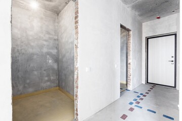 interior of the apartment without decoration in gray colors. rough finish
