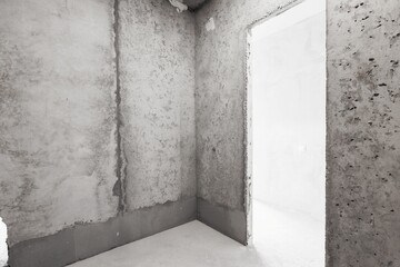 interior of the apartment without decoration in gray colors. rough finish