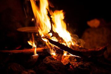 dark scene of camp fire with pot, lifestyle people concept