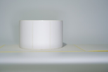 Blank sticky label roll for thermal transfer printing price. Rolls of white labels isolated. Labels for direct thermal or thermal transfer printing. Label crisis
