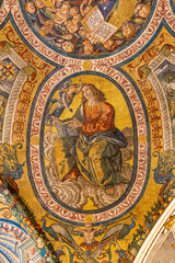 Fototapeta na wymiar Close-up on colorful religious mosaic decorating interior of historic Basilica in Rome showing a saint