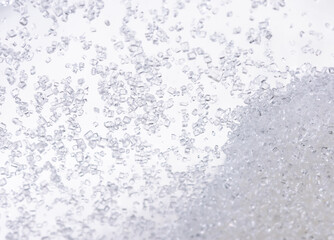 Close up of crystal sugar in Glass bottles on white background.