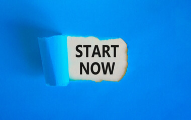 Start now symbol. Concept words Start now on beautiful white paper. Beautiful blue table blue background. Business marketing, motivational start now concept. Copy space.