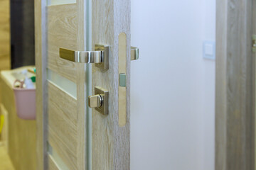 Lock handles were installed by handyman on wooden door