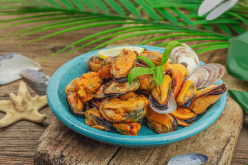 Mussels with oil, spices and greens. Healthy seafood is rich in omega. Marine decor