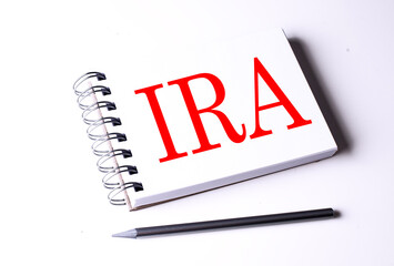 Text IRA on notebook on the white background, business
