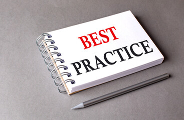 BEST PRACTICE word on notebook on grey background