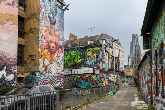 London, UK, 23 May 2023: Brick Lane, Shoreditch. Old houses painted by artists