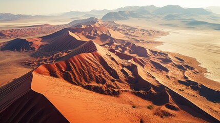 Fototapeta na wymiar Endless Crimson Waves: Namib's Desert from Above
