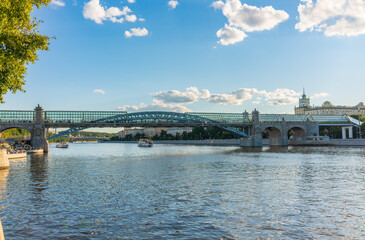 Fototapeta premium View of the Moscow river embakment, Pushkinsky bridge and cruise ships at sunset.