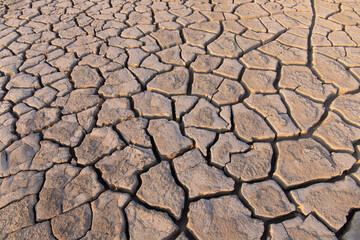 Volcanic cracks in the clay on the ground.