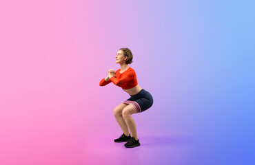 Fototapeta na wymiar Full body length gaiety shot athletic and sporty young woman with fitness elastic resistance band in squat exercise posture on isolated background. Healthy active and body care lifestyle.