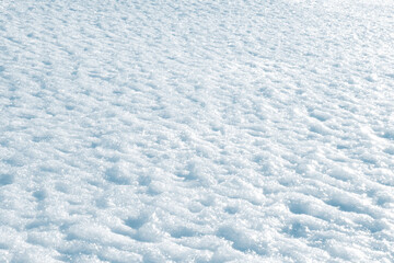 Texture. snow ground wallpaper with ripples, spectacular clear frosty snow and glistening in the sun,