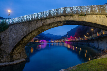 Romanesque style bridge that crosses the Brembo river