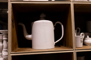 A wide variety of white plates bowls and mugs lined up