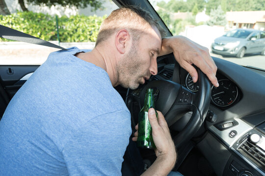 drunk man sleepy when driving his car