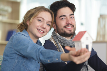happy couple showing a house