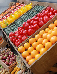 Fresh local organic vegetables at farmers market. peppers, tomatoes and cucumbers on a wooden counter