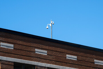 Surveillance cameras on a building rooftop