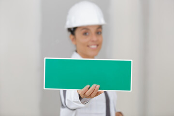 woman showing wet paint sign