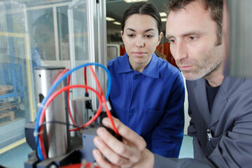 two administrators male and female at server room