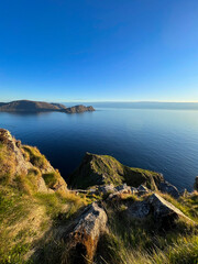 norwegian sea with green rocks