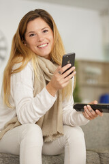 woman watch television and her phone