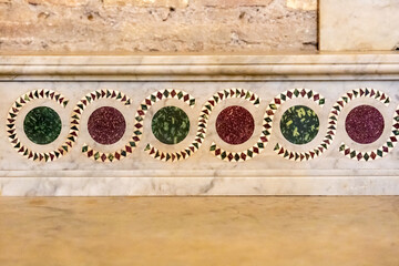 Close-up on decorative pattern on church wall in Italy