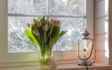 Bouquet of beautiful pink tulips on a wooden windowsill. Spring concept, Happy 8 March, Women's Day