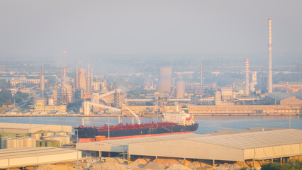Drone shot of industrial and port area of Ravenna,production district is made up of a chemical and petrochemical pole, thermoelectric and metallurgical plants.