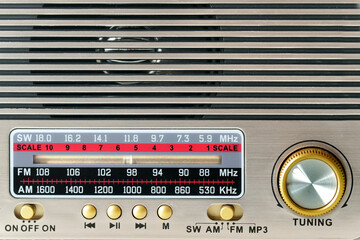 Radio dial close-up and volume knob