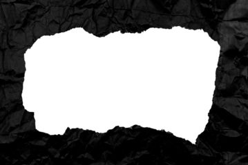 Black paper background with copy space. Hole on a crumpled dark sheet