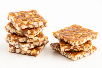 Pile of boy foot or pé de moleque isolated on white background. Selective focus.