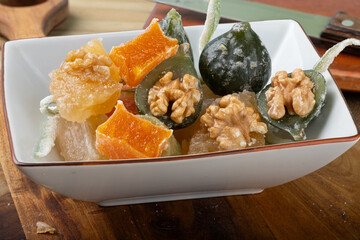 Brazilian crystalized fruits in a bowl. Selective focus .