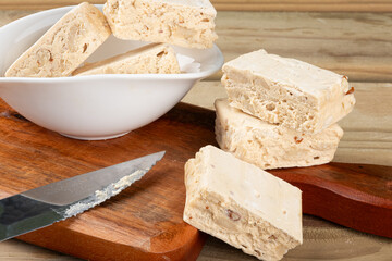 Nougats on cutting board. Selective focus.