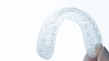 Whitening dental tray on white background.