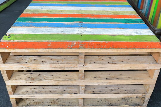 Colourful wooden pallets of the Australian standard dimensions of 1165 x 1165 mm in Queen Victoria Market. Melbourne-VIC-975