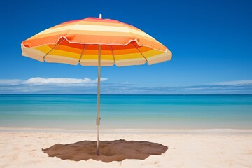 Beach umbrella on the beach near the ocean on a bright sunny day