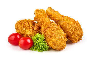 Breaded crispy chicken legs with ketchup, isolated on white background.