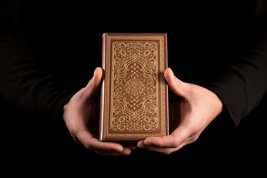 Qur'an in hand holy book of muslims public item