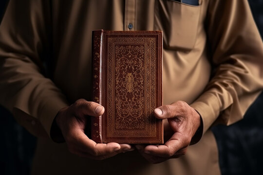 Qur'an in hand holy book of muslims public item
